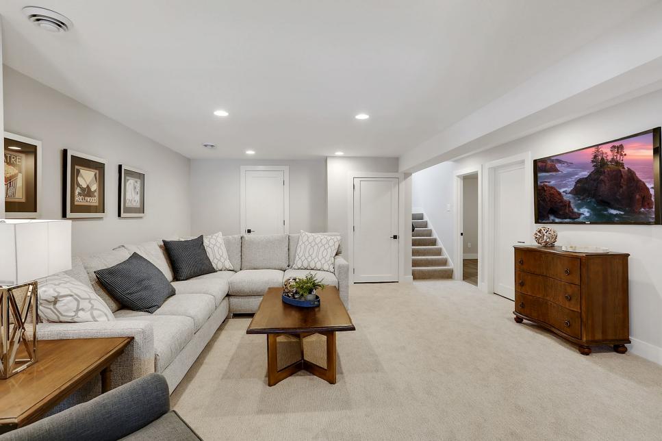 Basement living area with neutral sectional